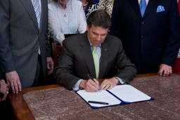 Governor Perry signing the bill
