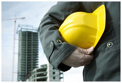 Worker holding a yellow hard hat